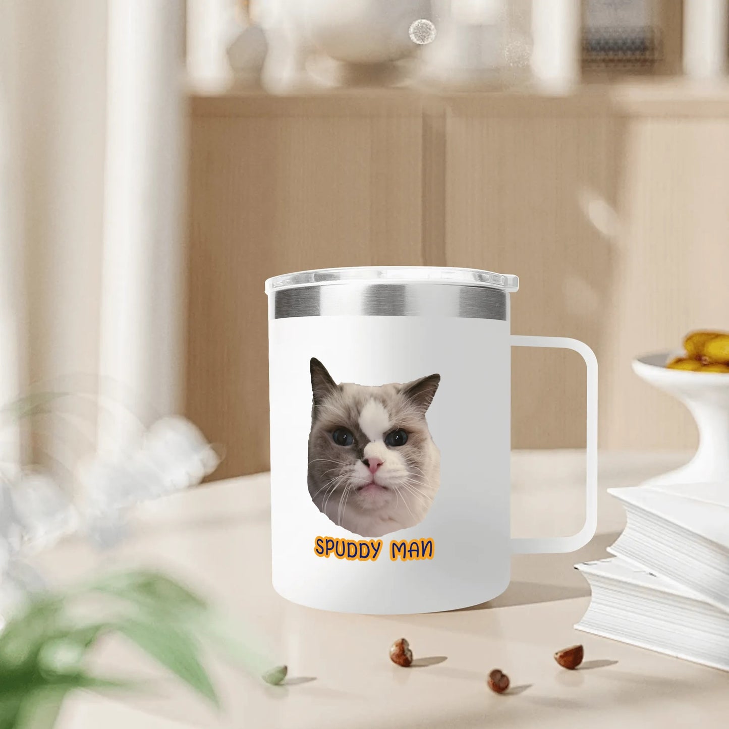 Mug with a cat design and 'Spuddy Man' text on a blurred background